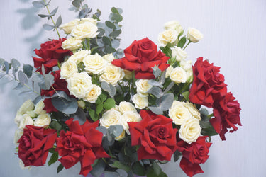 Red Roses in Ceramic Vase
